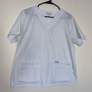 Landau white scrub top in size medium.